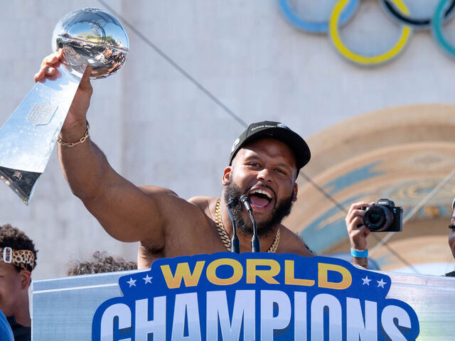 Los Angeles, CA - February 16:Aaron Donald with the Lombardi trophy at the LA Rams celebrated their Super Bowl win at the Los Angeles Memorial Coliseum Wednesday, February 16, 2022. Los Angeles mayor Eric Garcetti declared Wednesday Rams Day in Los Angeles.