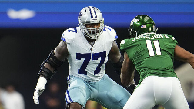 ARLINGTON, TX - SEPTEMBER 17: Tyron Smith #77 of the Dallas Cowboys defends during a football game at AT&T Stadium on September 17, 2023 in Arlington, Texas.