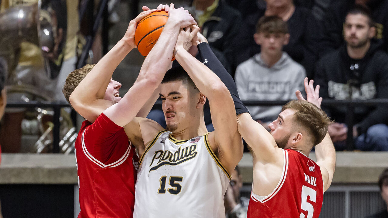 WEST LAFAYETTE, INDIANA - MARCH 10: Zach Edey #15 of the Purdue Boilermakers tries to hang on to the ball as Wisconsin Badgers defend at Mackey Arena on March 10, 2024 in West Lafayette, Indiana.
