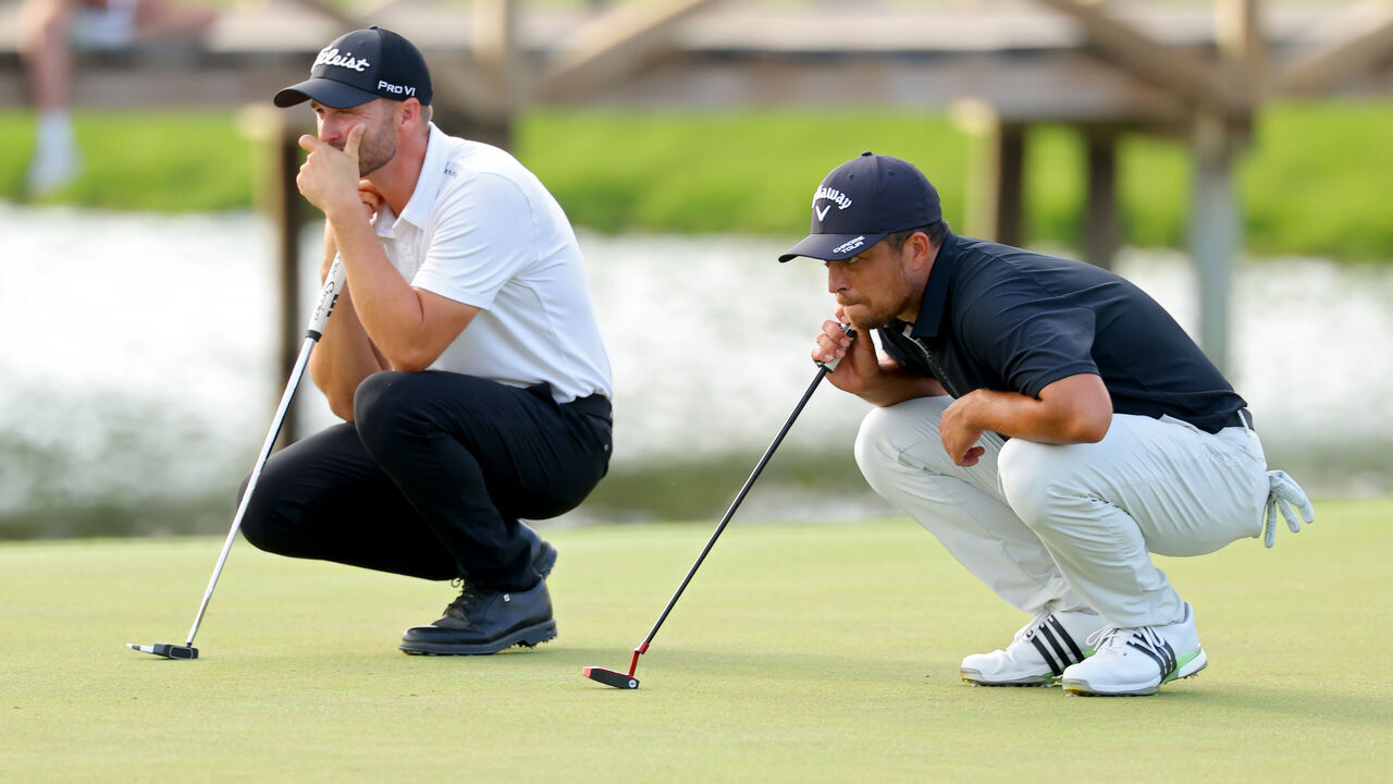 PONTE VEDRA BEACH, FLORIDA - MARCH 16: Wyndham Clark of the United States and Xander Schauffele of the United States lines up a putt on the 12th green during the third round of THE PLAYERS Championship at TPC Sawgrass on March 16, 2024 in Ponte Vedra Beach, Florida.