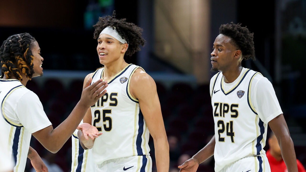 CLEVELAND, OH - MARCH 14: Akron Zips forward Enrique Freeman (25) celebrates with teammates during the second half of the MAC Men's Basketball Tournament Quarterfinal game between the Akron Zips and Miami (OH) Redhawks on March 14, 2024, at Rocket Mortgage FieldHouse in Cleveland, OH.