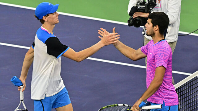 Spain's Carlos Alcaraz (R) greets Italy's Jannik Sinner at the net after Alcaraz's victory during the ATP-WTA Indian Wells Masters men's semifinal tennis match at the Indian Wells Tennis Garden in Indian Wells, California, on March 16, 2024.