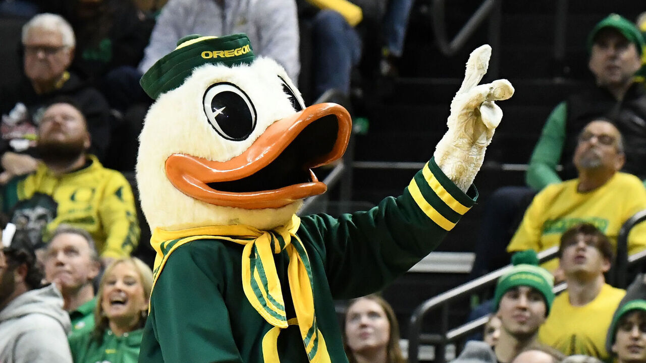 EUGENE, OR - FEBRUARY 08: The Oregon Ducks mascot, Puddles, performs for the crowd during a PAC-12 Conference college basketball game between the Oregon Ducks and Washington Huskies on February 8, 2024 at Matthew Knight Arena in Eugene, Oregon.