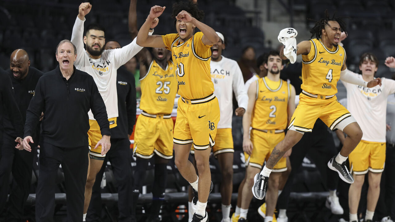 HENDERSON, NEVADA - MARCH 15: Members of the Long Beach State 49ers bench react during the first half of their game against the UC Irvine Anteaters during the Big West Conference basketball tournament at The Dollar Loan Center on March 15, 2024 in Henderson, Nevada.