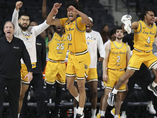HENDERSON, NEVADA - MARCH 15: Members of the Long Beach State 49ers bench react during the first half of their game against the UC Irvine Anteaters during the Big West Conference basketball tournament at The Dollar Loan Center on March 15, 2024 in Henderson, Nevada.