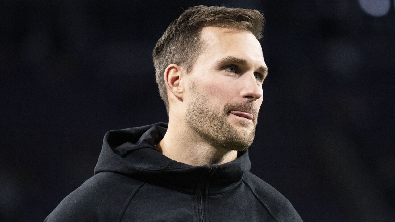 MINNEAPOLIS, MINNESOTA - DECEMBER 31: Kirk Cousins #8 of the Minnesota Vikings looks on from the sidelines before the game against the Green Bay Packers at U.S. Bank Stadium on December 31, 2023 in Minneapolis, Minnesota.