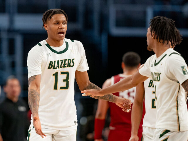 FORT WORTH, TX - MARCH 17: Temple Owls guard Connor Gal (13) high fives teammates after a called timeout during the American Athletic Conference Championship game between the Temple Owls and the UAB Blazers on March 17, 2024 at Dickies Arena in Fort Worth, Texas.
