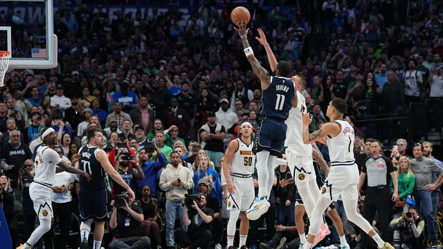 DALLAS, TX - MARCH 17: Kyrie Irving #11 of the Dallas Mavericks shoots the game winning basket against the Denver Nuggets on March 17, 2024 at the American Airlines Center in Dallas, Texas. Mandatory Copyright Notice: Copyright 2024 NBAE