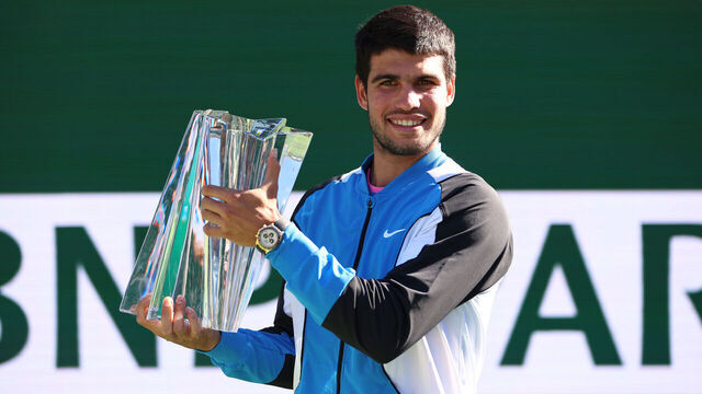 INDIAN WELLS, CALIFORNIA - MARCH 17: Carlos Alcaraz of Spain holds his winners trophy after his straight sets victory against Daniil Medvedev in the Men's Final during the BNP Paribas Open at Indian Wells Tennis Garden on March 17, 2024 in Indian Wells, California.