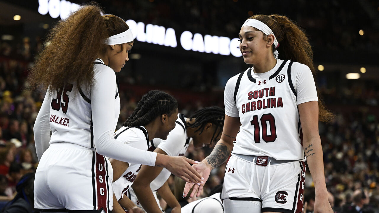 GREENVILLE, SOUTH CAROLINA - MARCH 10: Kamilla Cardoso #10 high fives Sakima Walker #35 of the South Carolina Gamecocks after being substituted off the court against the LSU Lady Tigers in the third quarter during the championship game of the SEC Women's Basketball Tournament at Bon Secours Wellness Arena on March 10, 2024 in Greenville, South Carolina.