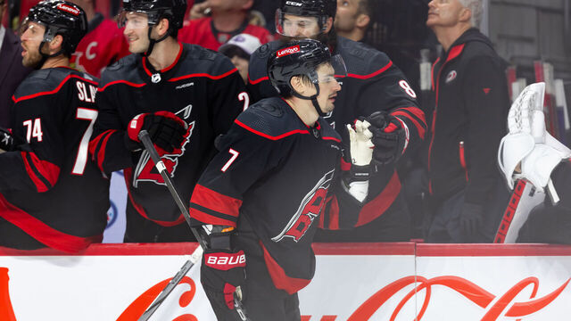 OTTAWA, ON - MARCH 17: Carolina Hurricanes Defenceman Dmitry Orlov (7) skates by the bench to celebrate his goal during third period National Hockey League action between the Carolina Hurricanes and Ottawa Senators on March 17, 2024, at Canadian Tire Centre in Ottawa, ON, Canada.