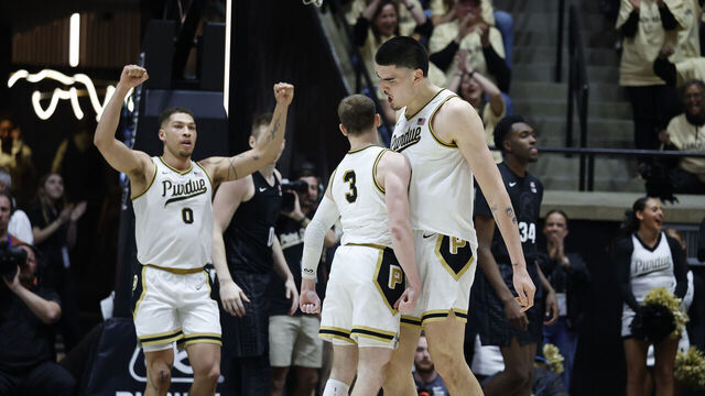 WEST LAFAYETTE, IN - MARCH 02: Purdue Boilermakers guard Braden Smith (3) give center Zach Edey (15) a chest bump during a game against the Michigan State Spartans on March 2, 2024, at Mackey Arena in West Lafayette, Indiana.