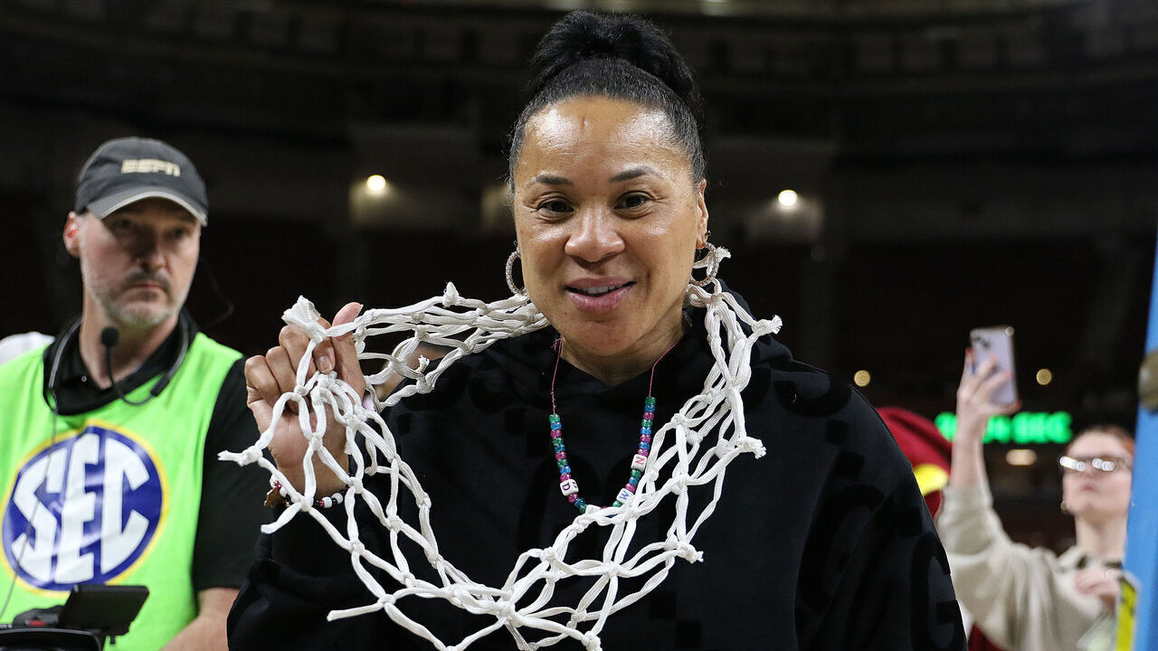 GREENVILLE, SC - MARCH 10: South Carolina Gamecocks head coach Dawn Staley wears the net in celebration of their championship victory during the SEC Women's Basketball Tournament Championship Game between the LSU Tigers and the South Carolina Gamecocks March 10, 2024 at Bon Secours Wellness Arena in Greenville, S.C.
