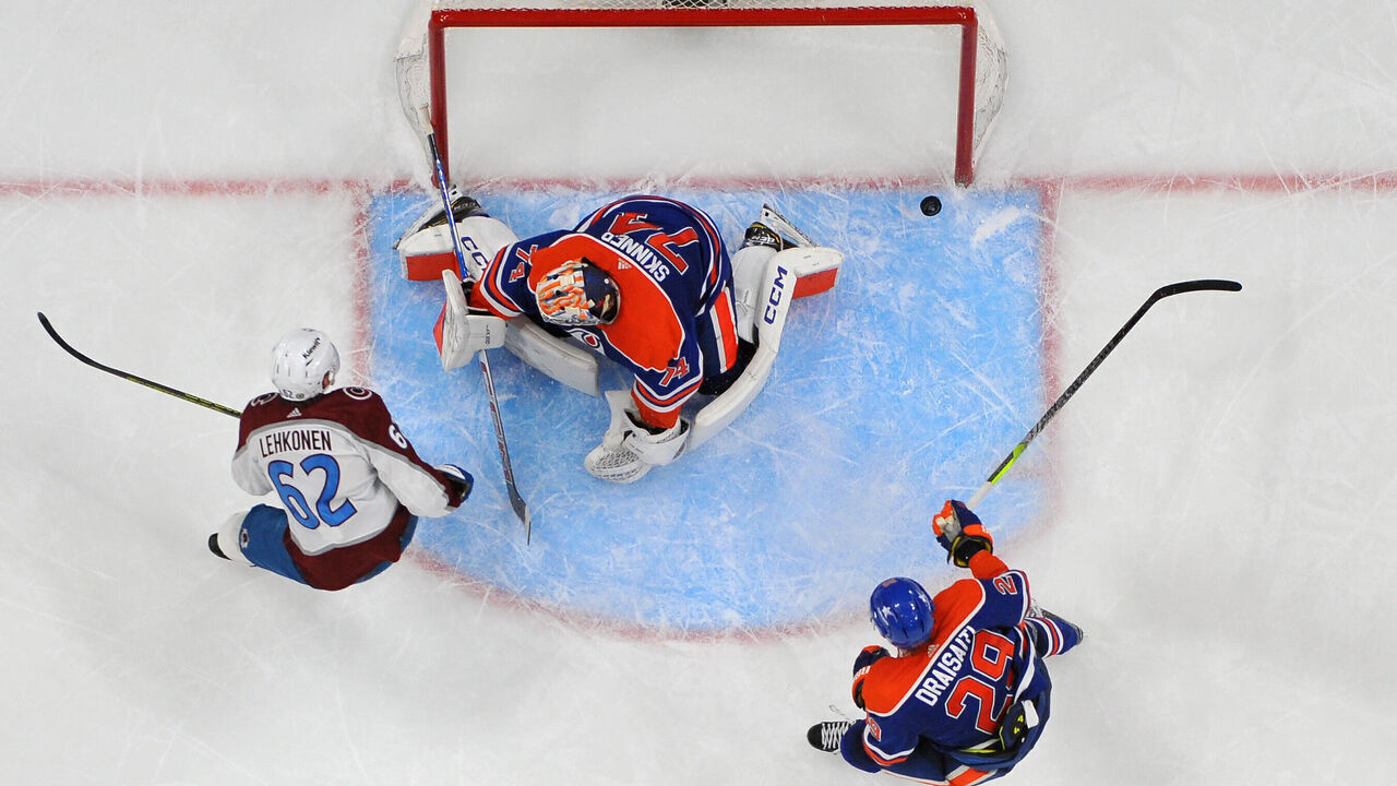 EDMONTON, CANADA - MARCH 16: Artturi Lehkonen #62 of the Colorado Avalanche scores the overtime winning goal against Stuart Skinner #74 of the Edmonton Oilers at Rogers Place on March 16, 2024, in Edmonton, Alberta, Canada.