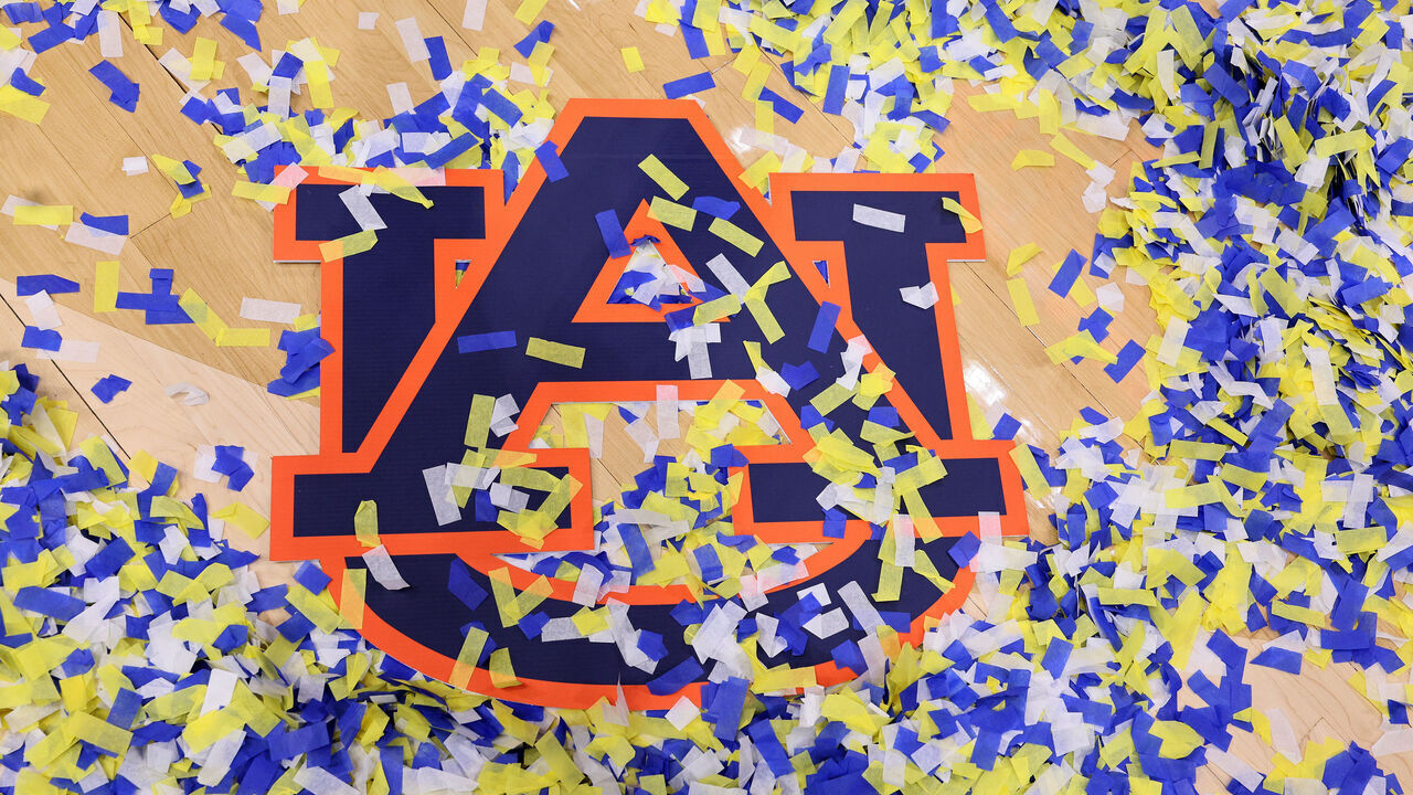 NASHVILLE, TENNESSEE - MARCH 17: Confetti covers the logo of the Auburn Tigers after their win against the Florida Gators in the championship game of the SEC Basketball Tournament at Bridgestone Arena on March 17, 2024 in Nashville, Tennessee.