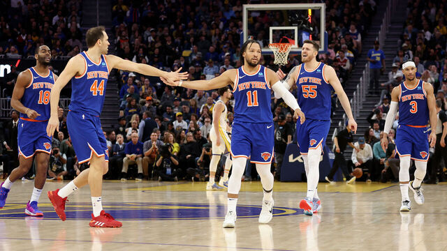 SAN FRANCISCO, CALIFORNIA - MARCH 18: Bojan Bogdanovic #44 high-fives Jalen Brunson #11 of the New York Knicks during a time out of their game against the Golden State Warriors in the second half at Chase Center on March 18, 2024 in San Francisco, California.