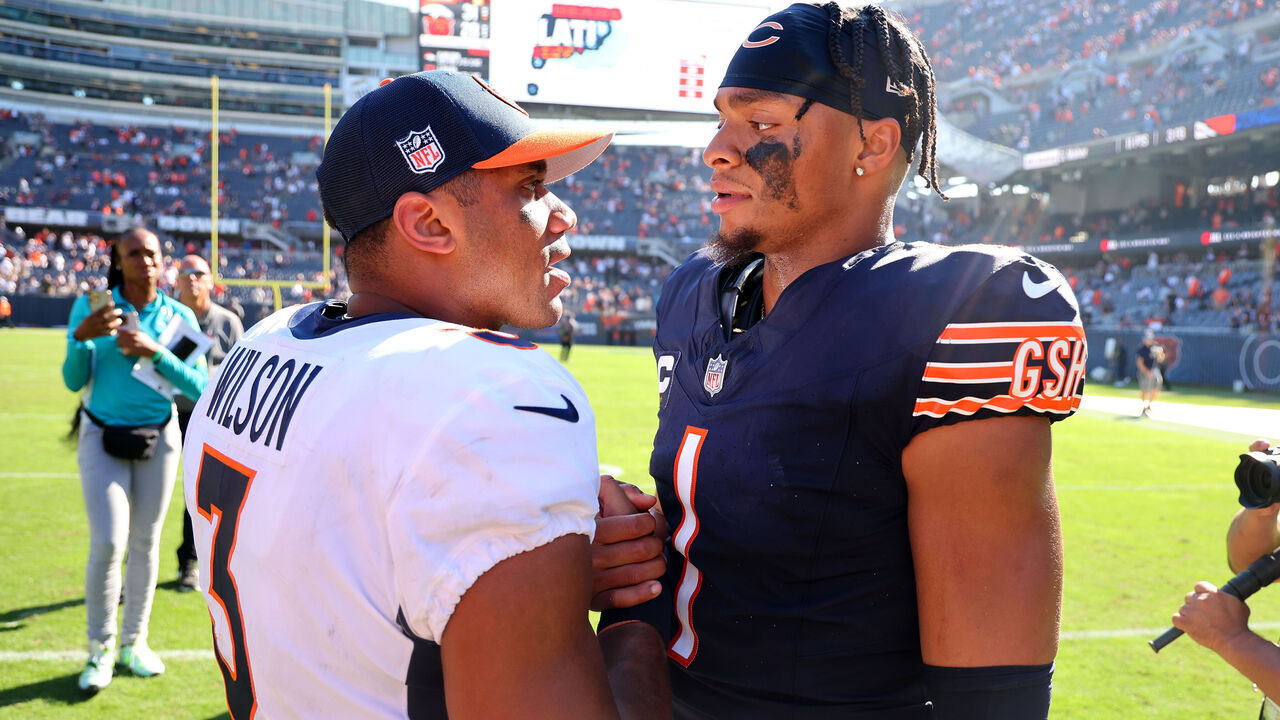 CHICAGO, ILLINOIS - OCTOBER 01: Russell Wilson #3 of the Denver Broncos and Justin Fields #1 of the Chicago Bears shake hands after the game at Soldier Field on October 01, 2023 in Chicago, Illinois. Denver defeats Chicago 31-28.