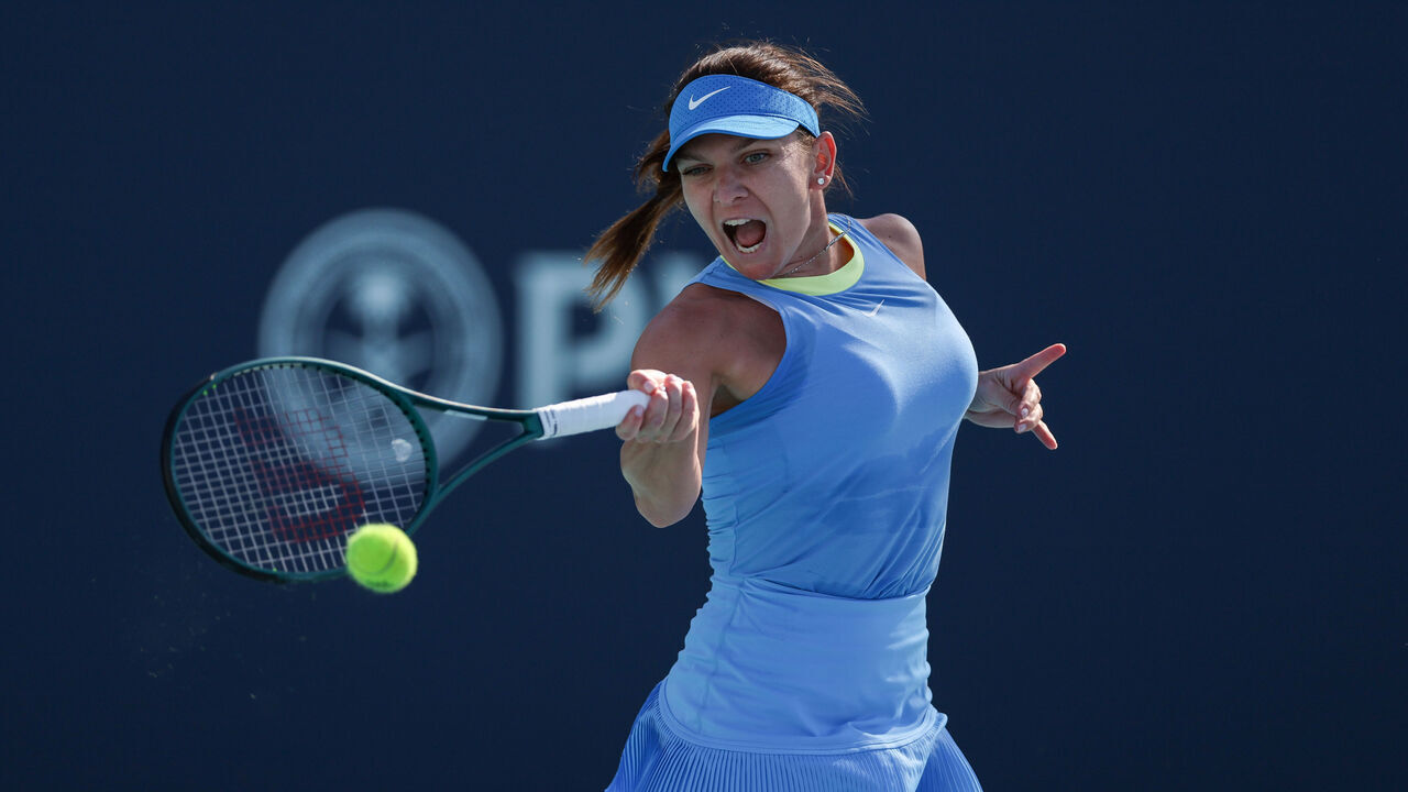 MIAMI GARDENS, FLORIDA - MARCH 19: Simona Halep of Romania returns a shot to Paula Badosa of Spain during her women's singles match during the Miami Open at Hard Rock Stadium on March 19, 2024 in Miami Gardens, Florida.