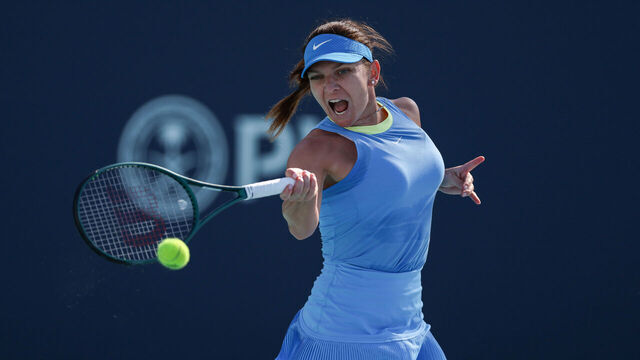MIAMI GARDENS, FLORIDA - MARCH 19: Simona Halep of Romania returns a shot to Paula Badosa of Spain during her women's singles match during the Miami Open at Hard Rock Stadium on March 19, 2024 in Miami Gardens, Florida.