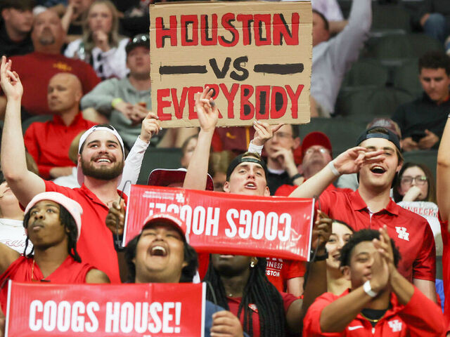 KANSAS CITY, MO - MARCH 15: Houston Cougars fans hold a sign saying "Houston v Everyone" in the second half of a Big 12 tournament semifinal game between the Texas Tech Red Raiders and Houston Cougars on Mar 15, 2024 at T-Mobile Center in Kansas City, MO.