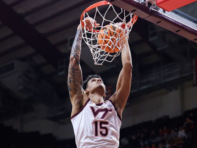 BLACKSBURG, VIRGINIA - MARCH 19: Lynn Kidd #15 of the Virginia Tech Hokies dunks the ball in the second half during the first round of the NIT tournament game against the Richmond Spiders at Cassell Coliseum on March 19, 2024 in Blacksburg, Virginia.