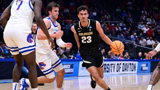 DAYTON, OHIO - MARCH 20: Tristan da Silva #23 of the Colorado Buffaloes drives to the basket as Tyson Degenhart #2 of the Boise State Broncos defends during the First Four round of the 2024 NCAA Men's Basketball Tournament held at University of Dayton Arena on March 20, 2024 in Dayton, Ohio.
