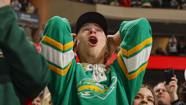 SAINT PAUL, MN - MARCH 10: A fan reacts after the Minnesota Wild score a goal during the game against the Nashville Predators at the Xcel Energy Center on March 10, 2024 in Saint Paul, Minnesota.
