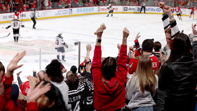 CHICAGO, ILLINOIS - MARCH 10: Fans cheer after the Chicago Blackhawks score against the Arizona Coyotes in the third period at the United Center on March 10, 2024 in Chicago, Illinois.