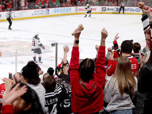 CHICAGO, ILLINOIS - MARCH 10: Fans cheer after the Chicago Blackhawks score against the Arizona Coyotes in the third period at the United Center on March 10, 2024 in Chicago, Illinois.