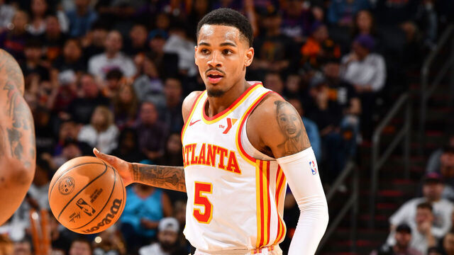 PHOENIX, AZ - MARCH 21: Dejounte Murray #5 of the Atlanta Hawks handles the ball during the game on March 21, 2024 at Footprint Center in Phoenix, Arizona. Mandatory Copyright Notice: Copyright 2024 NBAE