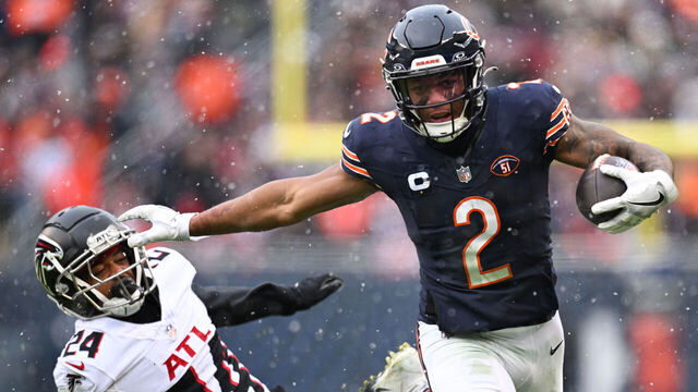 CHICAGO, ILLINOIS - DECEMBER 31: DJ Moore #2 of the Chicago Bears stiff arms A.J. Terrell #24 of the Atlanta Falcons during the third quarter at Soldier Field on December 31, 2023 in Chicago, Illinois.