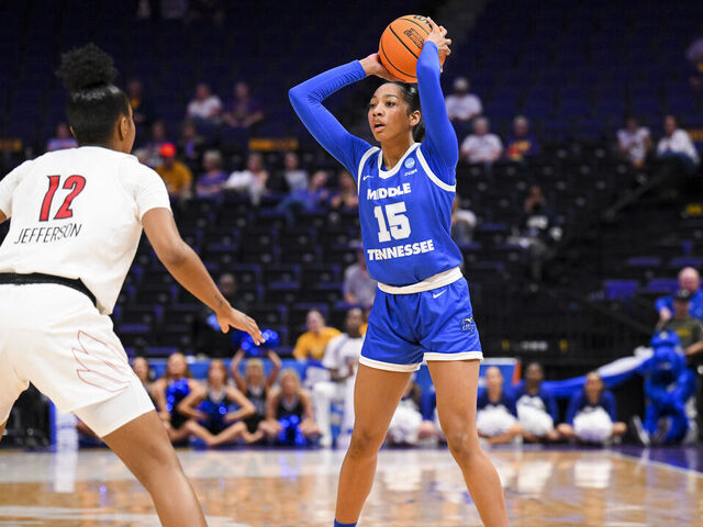 BATON ROUGE, LOUISIANA - MARCH 22: Ta'Mia Scott of the Middle Tennessee Blue Raiders looks for a pass against Kiki Jefferson of the Louisville Cardinals during the first round of the 2024 NCAA Women's Basketball Tournament held at Pete Maravich Assembly Center on March 22, 2024 in Baton Rouge, Louisiana.