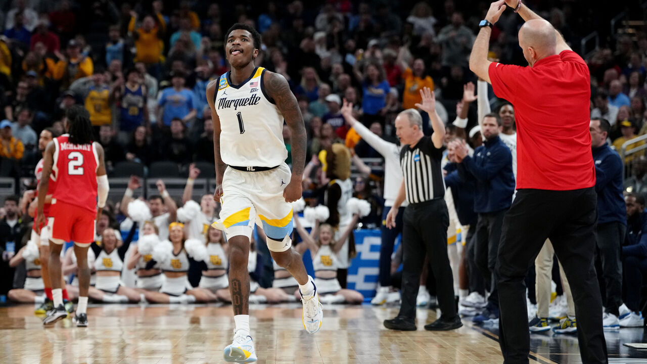 INDIANAPOLIS, INDIANA - MARCH 22: Kam Jones #1 of the Marquette Golden Eagles celebrates a three point basket against the Western Kentucky Hilltoppers during the second half in the first round of the NCAA Men's Basketball Tournament at Gainbridge Fieldhouse on March 22, 2024 in Indianapolis, Indiana.
