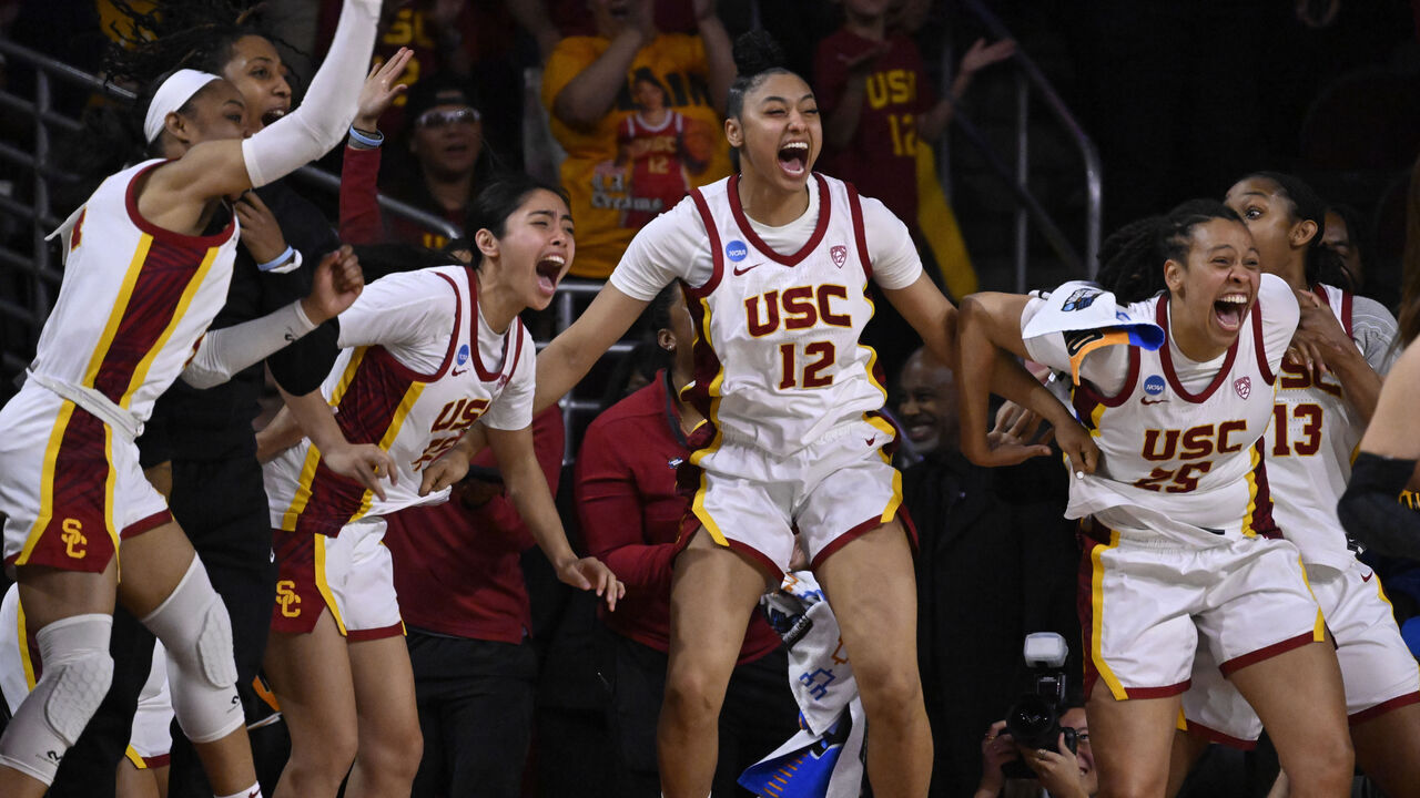 Los Angeles, CA - March 23: JuJu Watkins #12 of the USC Trojans and the bench react as India Otto (not pictured) of the USC Trojans scores against the Texas A&M-CC Islanders in the second half of a first round women's NCAA Tournament basketball game at the Galen Center in Los Angeles on Saturday, March 23, 2024.