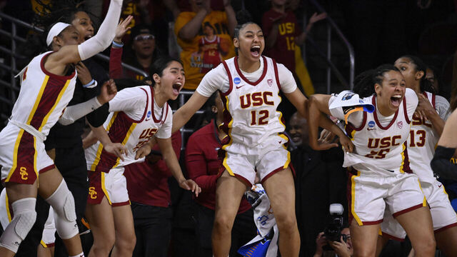 Los Angeles, CA - March 23: JuJu Watkins #12 of the USC Trojans and the bench react as India Otto (not pictured) of the USC Trojans scores against the Texas A&M-CC Islanders in the second half of a first round women's NCAA Tournament basketball game at the Galen Center in Los Angeles on Saturday, March 23, 2024.