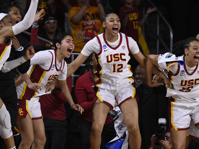 Los Angeles, CA - March 23: JuJu Watkins #12 of the USC Trojans and the bench react as India Otto (not pictured) of the USC Trojans scores against the Texas A&M-CC Islanders in the second half of a first round women's NCAA Tournament basketball game at the Galen Center in Los Angeles on Saturday, March 23, 2024.