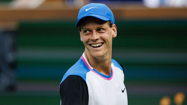 INDIAN WELLS, CALIFORNIA - MARCH 16: Jannik Sinner of Italy smiles at Carlos Alcaraz of Spain after a long rally duirng the semi-final of the BNP Paribas Open at Indian Wells Tennis Garden on March 16, 2024 in Indian Wells, California.