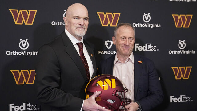 ASHBURN, VIRGINIA - FEBRUARY 05: Head coach Dan Quinn of the Washington Commanders poses for a photo with managing partner Josh Harris following a press conference at OrthoVirginia Training Center at Commanders Park on February 05, 2024 in Ashburn, Virginia.