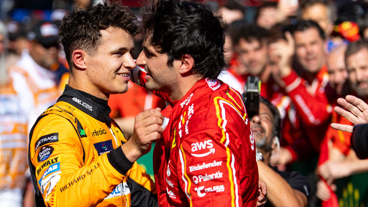 MELBOURNE, AUSTRALIA - MARCH 24: Lando Norris of Great Britain and McLaren F1 and Carlos Sainz of Spain and Scuderia Ferrari hug in parc ferme after the F1 Grand Prix of Australia at Albert Park Circuit on March 24, 2024 in Melbourne, Australia.