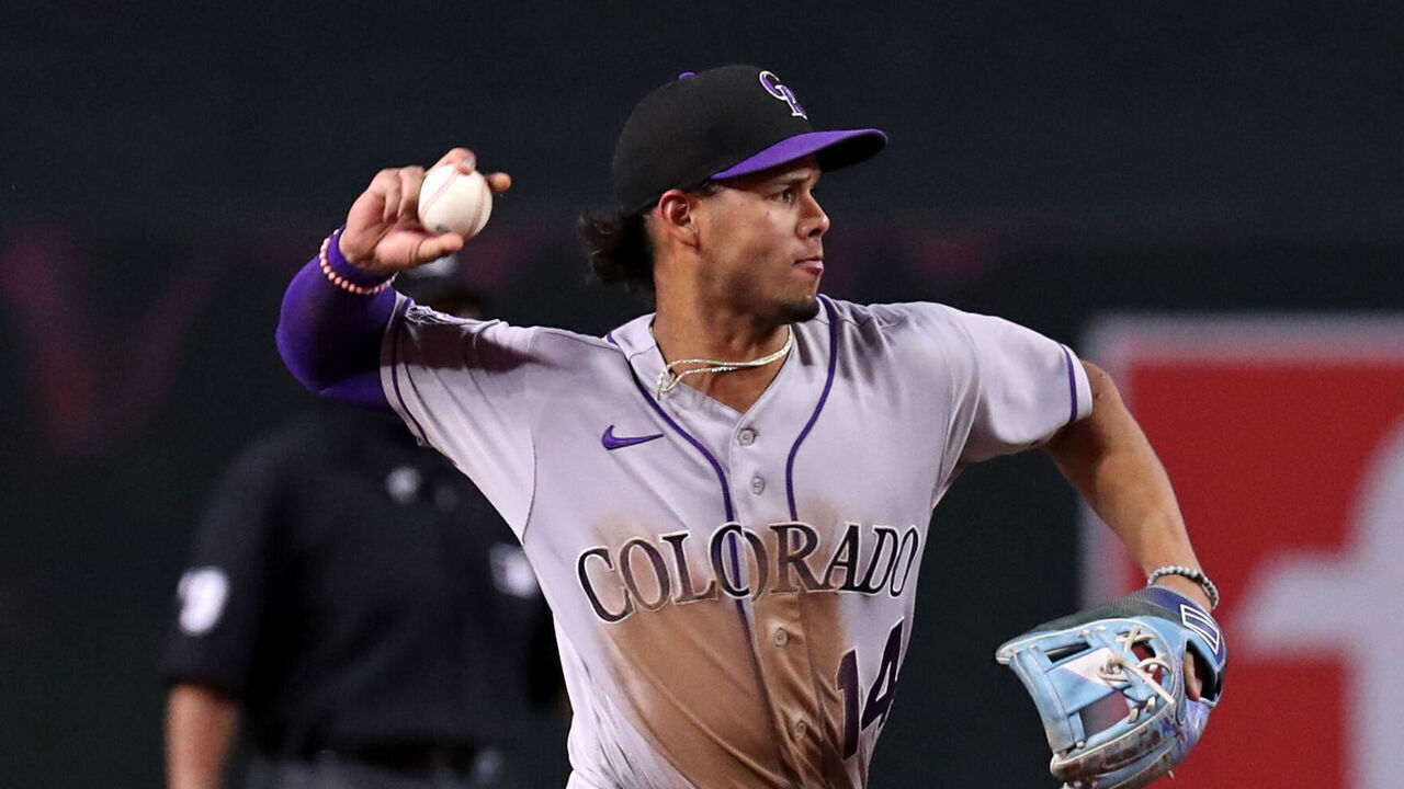 PHOENIX, AZ - SEPTEMBER 05: Colorado Rockies shortstop Ezequiel Tovar (14) makes a throw to first base during a baseball game between the Colorado Rockies and the Arizona Diamondbacks on September 5th, 2023, at Chase Field in Phoenix, AZ.