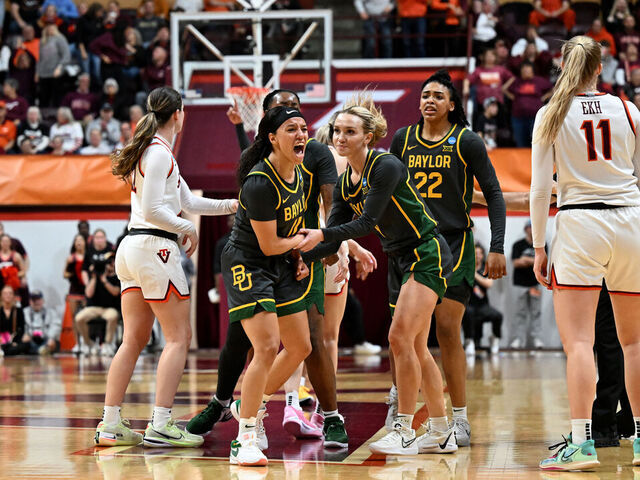 BLACKSBURG, VIRGINIA - MARCH 24: Jada Walker #11 of the Baylor Lady Bears celebrates with teammates after hitting a long range shot at the end of the third quarter of a game against the Virginia Tech Hokies during the second round of the 2024 NCAA Women's Basketball Tournament held at Cassell Coliseum on March 24, 2024 in Blacksburg, Virginia.