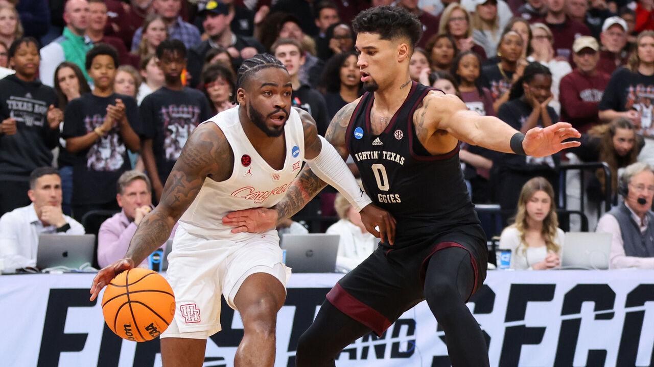 MEMPHIS, TENNESSEE - MARCH 24: Jamal Shead #1 of the Houston Cougars drives to the basket against Jace Carter #0 of the Texas A&M Aggies during the first half in the second round of the NCAA Men's Basketball Tournament at FedExForum on March 24, 2024 in Memphis, Tennessee.