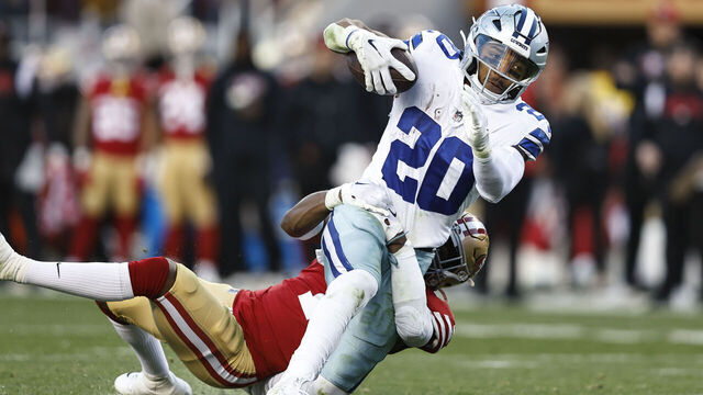 SANTA CLARA, CALIFORNIA - JANUARY 22: Tony Pollard #20 of the Dallas Cowboys is tackled by Jimmie Ward #1 of the San Francisco 49ers as he runs with the ball and gets injured during an NFL divisional round playoff football game between the San Francisco 49ers and the Dallas Cowboys at Levi's Stadium on January 22, 2023 in Santa Clara, California.