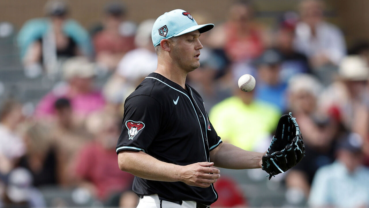 SCOTTSDALE, ARIZONA - MARCH 18: Paul Sewald #38 of the Arizona Diamondbacks walks back to the mound after a pitch during a spring training game against the Oakland Athletics at Salt River Fields at Talking Stick on March 18, 2024 in Scottsdale, Arizona.