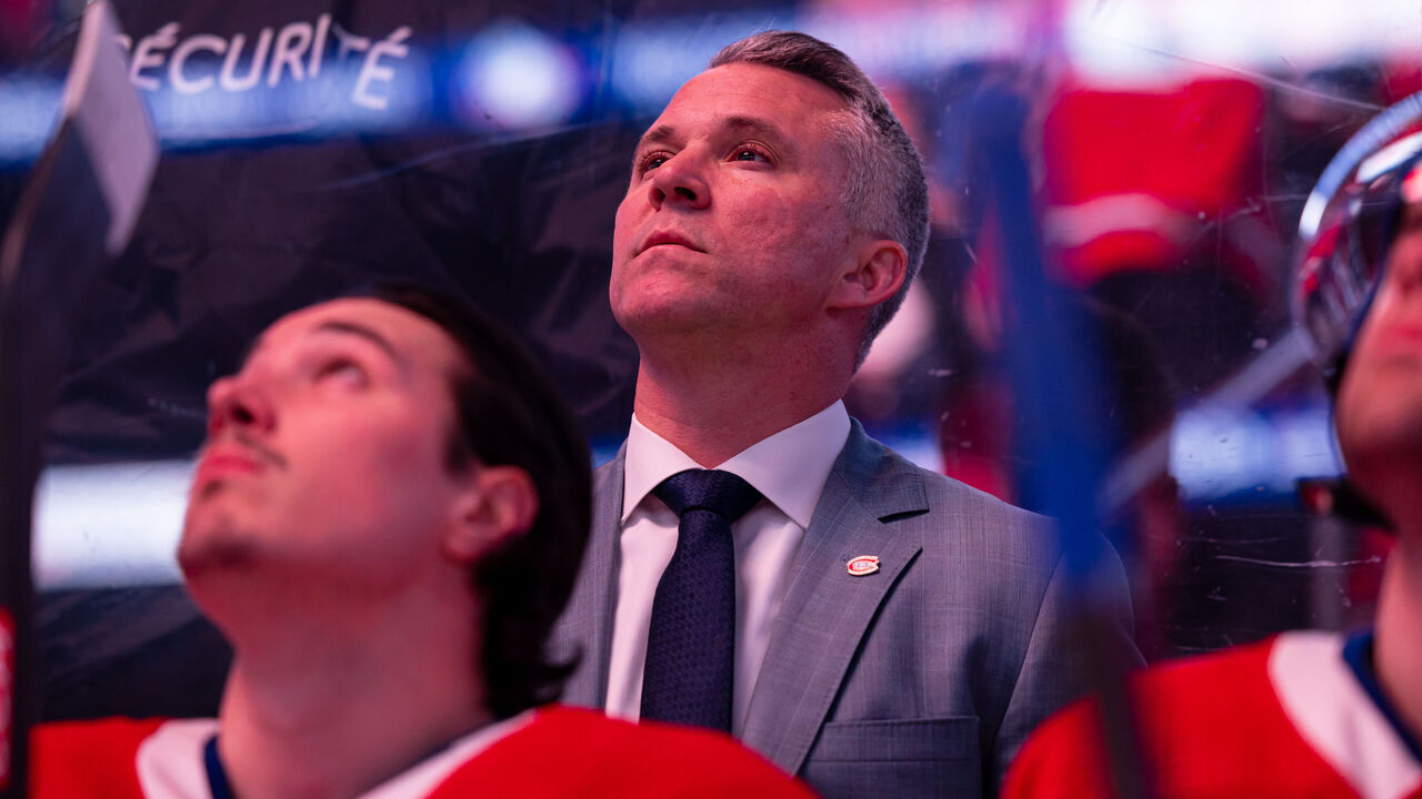 MONTREAL, CANADA - MARCH 14: Montreal Canadiens Head Coach Martin St-Louis looks on from behind the bench before the national anthem of the NHL regular season game between the Montreal Canadiens and the Boston Bruins at the Bell Centre on March 14, 2024 in Montreal, Quebec, Canada. The Boston Bruins defeated the Montreal Canadiens by a score of 2-1 in overtime.