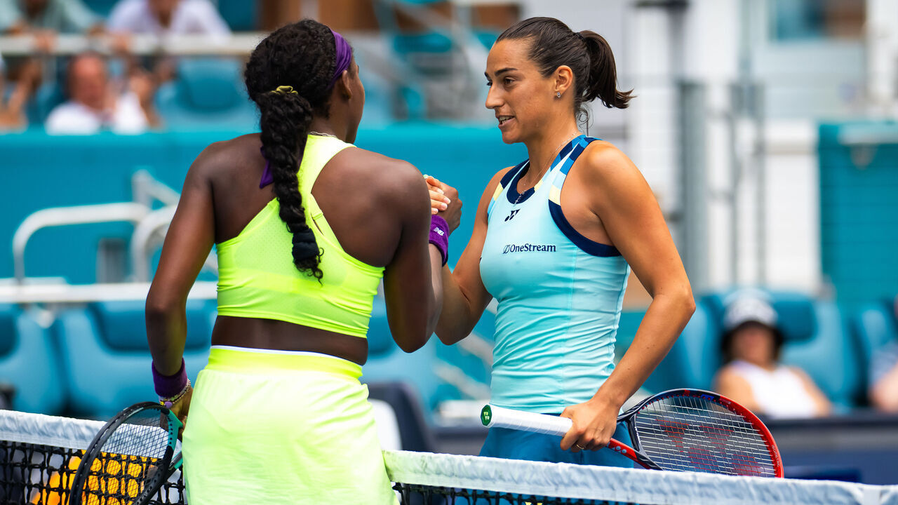 MIAMI GARDENS, FLORIDA - MARCH 25: Coco Gauff of the United States and Caroline Garcia of France shake hands at the net after the fourth round on Day 10 of the Miami Open Presented by Itau at Hard Rock Stadium on March 25, 2024 in Miami Gardens, Florida