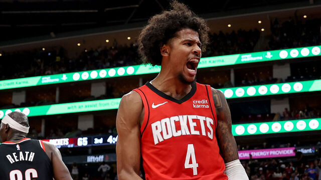 HOUSTON, TEXAS - MARCH 25: Jalen Green #4 of the Houston Rockets reacts after a dunk in the second half against the Portland Trail Blazers at Toyota Center on March 25, 2024 in Houston, Texas.