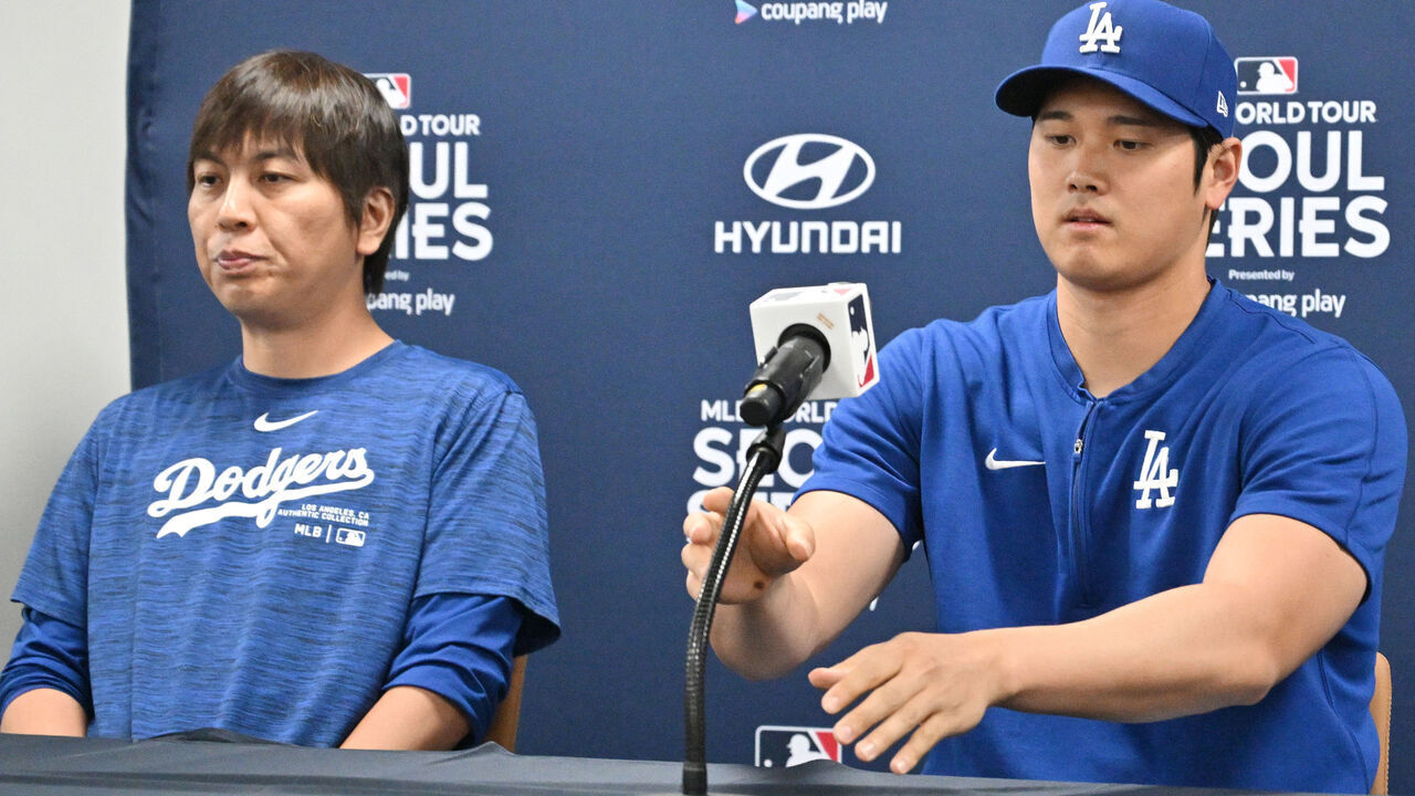 This picture taken on March 16, 2024 shows Los Angeles Dodgers' Shohei Ohtani (R) and his interpreter Ippei Mizuhara (L) attending a press conference at Gocheok Sky Dome in Seoul ahead of the 2024 MLB Seoul Series baseball game between Los Angeles Dodgers and San Diego Padres. The Los Angeles Dodgers said on March 21 they had fired Shohei Ohtani's interpreter after the Japanese baseball star's representatives claimed he had been the victim of "a massive theft" reported to involve millions of dollars.