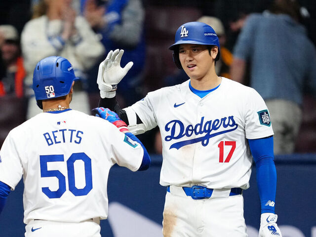 SEOUL, SOUTH KOREA - MARCH 21: Jason Heyward #23 and Shohei Ohtani #17 greet Mookie Betts #50 of the Los Angeles Dodgers after his two-run home run in the fifth inning of the 2024 Seoul Series game between the San Diego Padres and the Los Angeles Dodgers at Gocheok Sky Dome on Thursday, March 21, 2024 in Seoul, California.