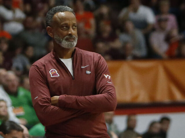 BLACKSBURG, VA - MARCH 22: Virginia Tech Hokies Head Coach Kenny Brooks looks on from the sidelines during the Marshall Thundering Herd game versus the Virginia Tech Hokies in the first round of the NCAA Division I Women's Championship on March 22, 2024, at Cassell Coliseum in Blacksburg, VA.